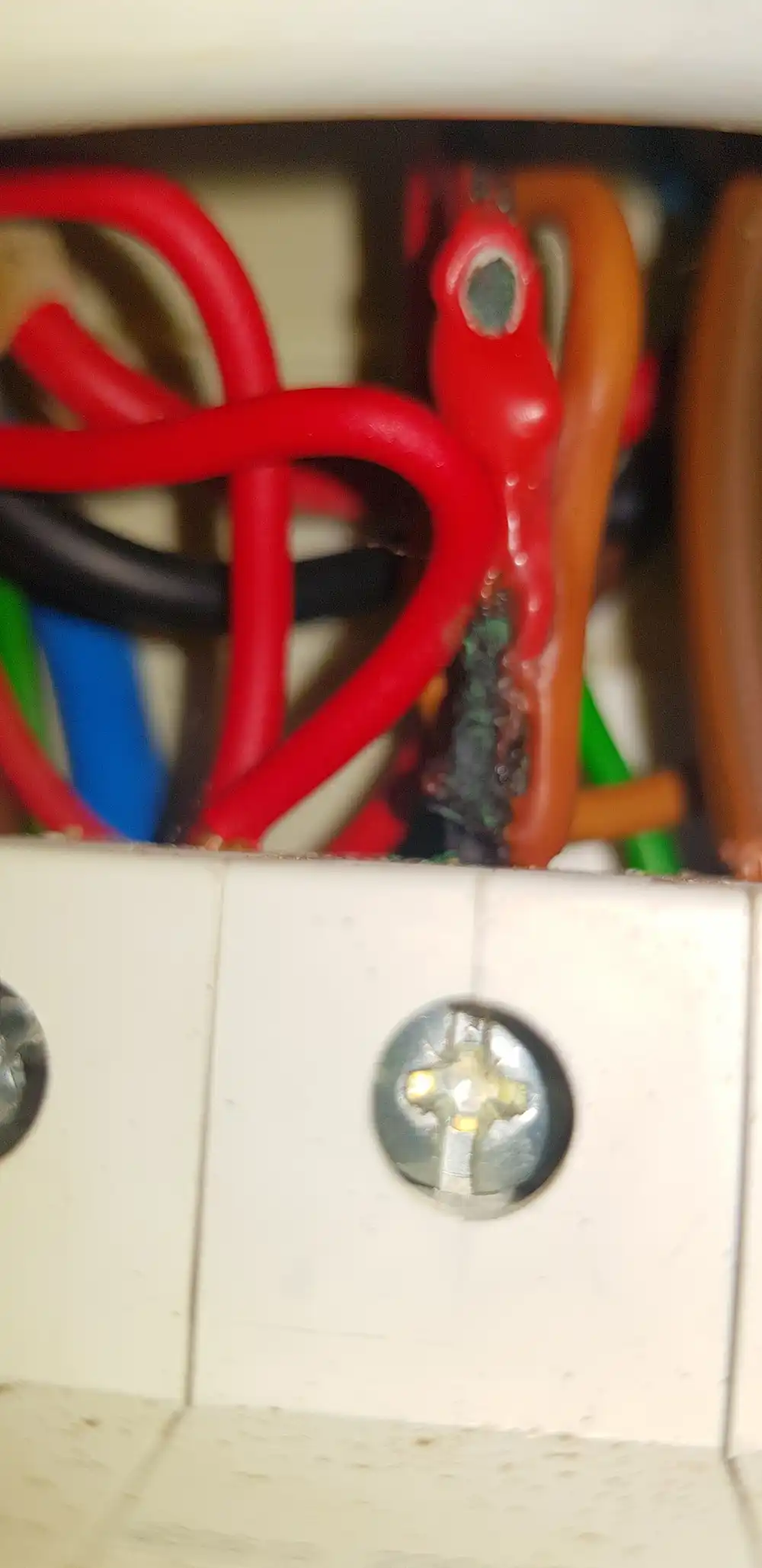 Overheated cables found during EICR electrical inspection, East Devon
